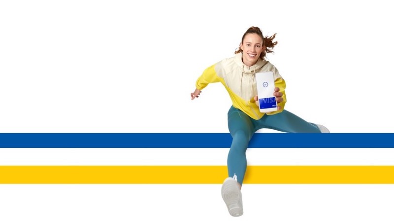 woman jumping over visa logo