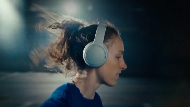 athlete running with headphones
